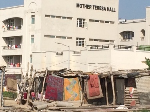 Construction worker dwelling outside of Mother Teresa girls' hostel on campus